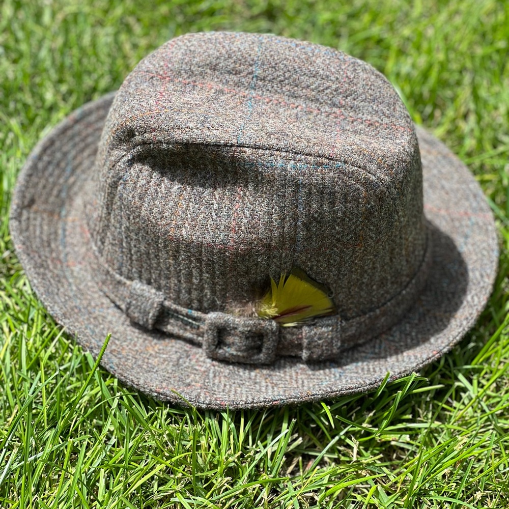 Men’s wool Stetson hat with yellow feather.
